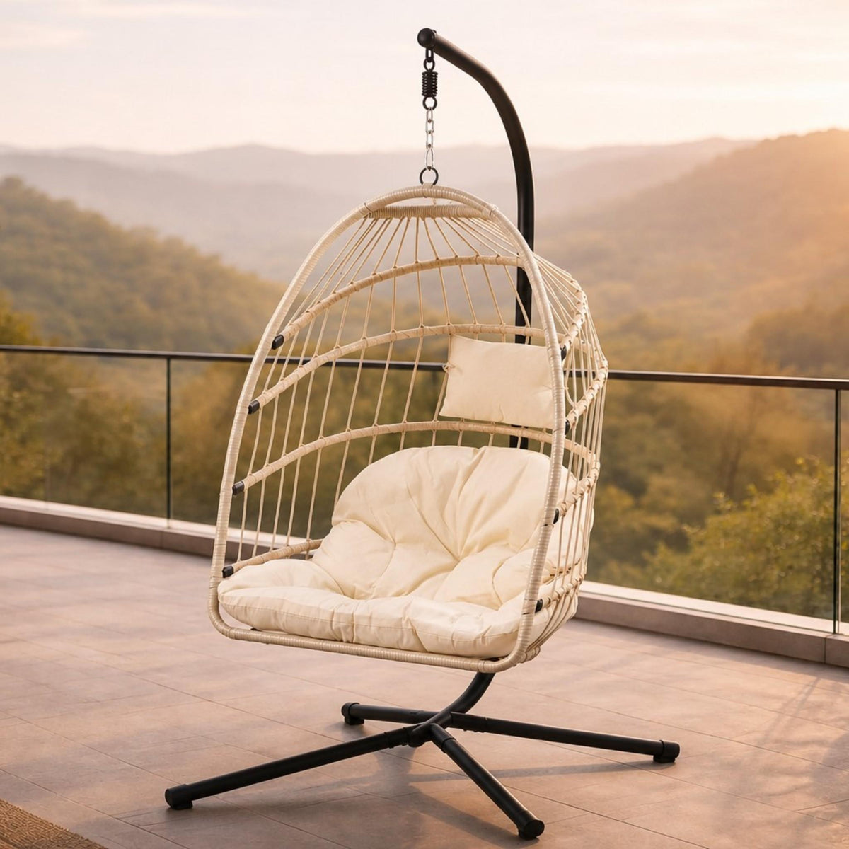 Madison Hanging Chair in beige, shown in a serene, outdoor patio space. | Outdoor chairs, hanging chair, patio furniture, patio chairs