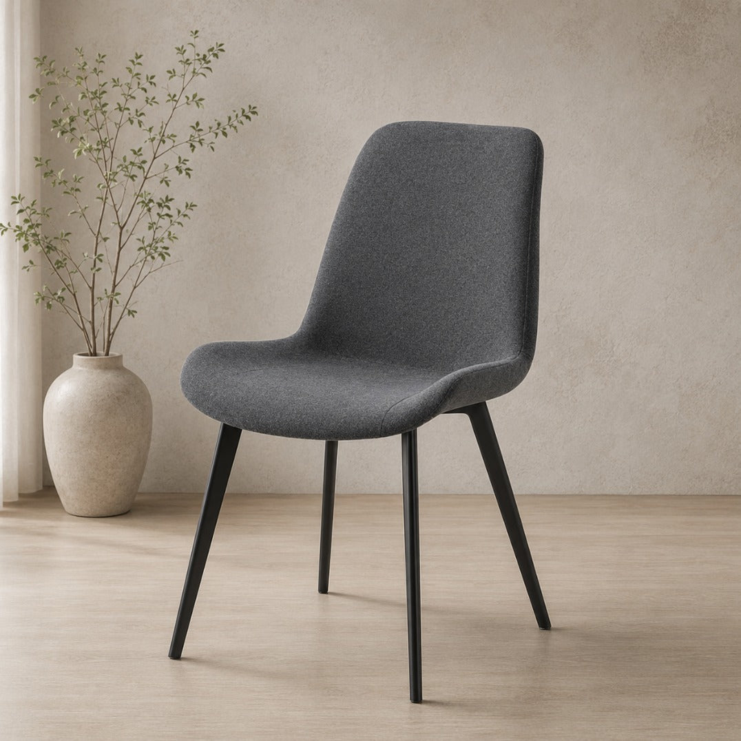 Angle view of the Nora fabric dining chair in Storm Grey | dining chairs, dining chairs for sale, fabric dining chair, dining chairs for round table