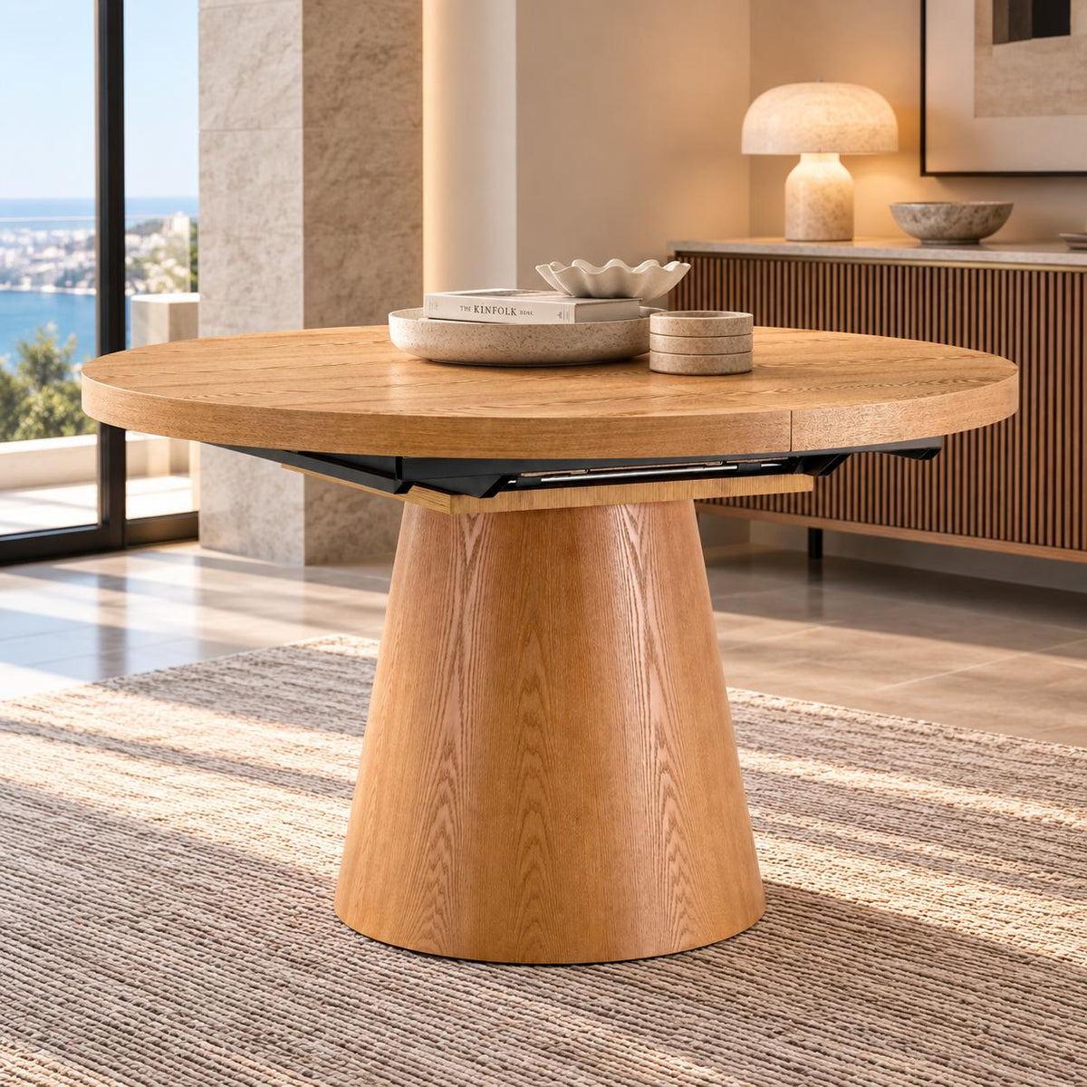 Gallery Everyday Arden Dining Table in Oak, featuring a round extendable oak veneer top and broad tapered pedestal base.