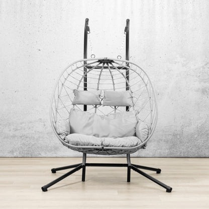 Spacious two-seater Emerson Hanging Egg Chair in grey, shown in a luxurious outdoor space. | Outdoor chairs, patio chairs for sale, hanging chair, egg chairs