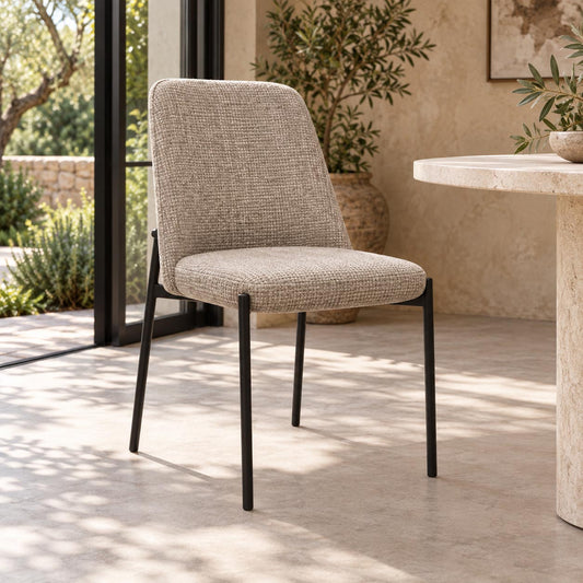 Gallery Everyday Monroe Dining Chair in Oxford Tan, featuring warm tan fabric upholstery, a gently curved backrest and slender black metal legs.