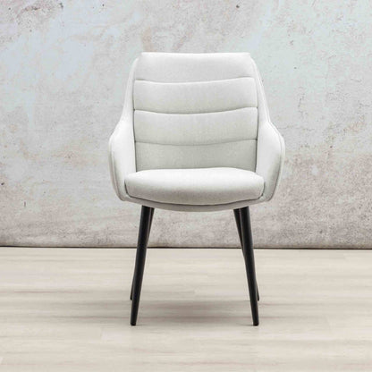 Gallery Everyday Octavia Fabric Dining Chair in Light Grey, featuring a curved upholstered backrest and tapered black legs.