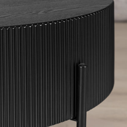 Side profile of Armstrong black coffee table showing ribbed wood-grain texture. | round coffee table, wood coffee table
