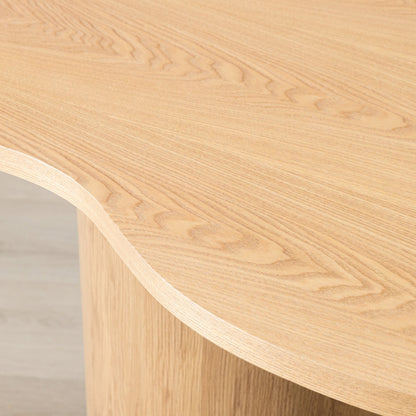 Close-up of Elodie natural dining table's curved organic edge and cylindrical wood leg. | dining room table, 4 seater dining table, wood dining table