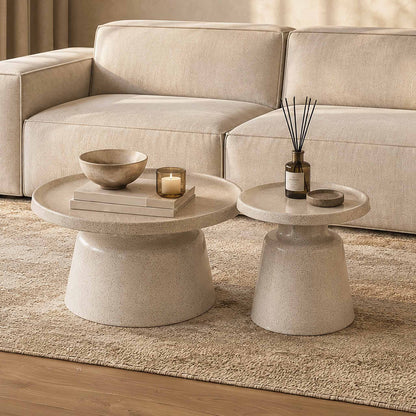 Gallery Everyday Minerva Coffee Tables - White Set of 2, featuring round concrete-look tables styled with neutral décor in a warm living room.