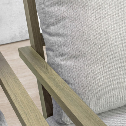Close-up of a weathered wood armrest and grey woven cushion on the Syracuse outdoor suite