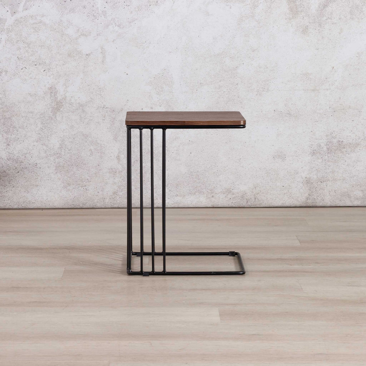 Gallery Everyday Camila Side Table in Walnut, featuring a dark wood rectangular top and black metal frame with vertical bar detailing.